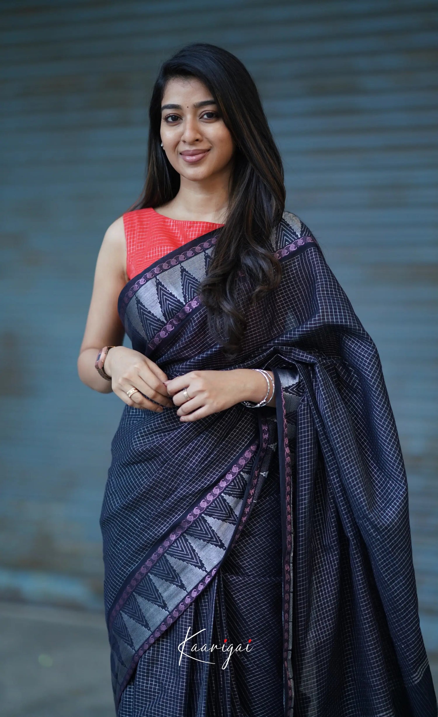 Saaral Black Shade And Orange Tone Sungudi Saree Sarees