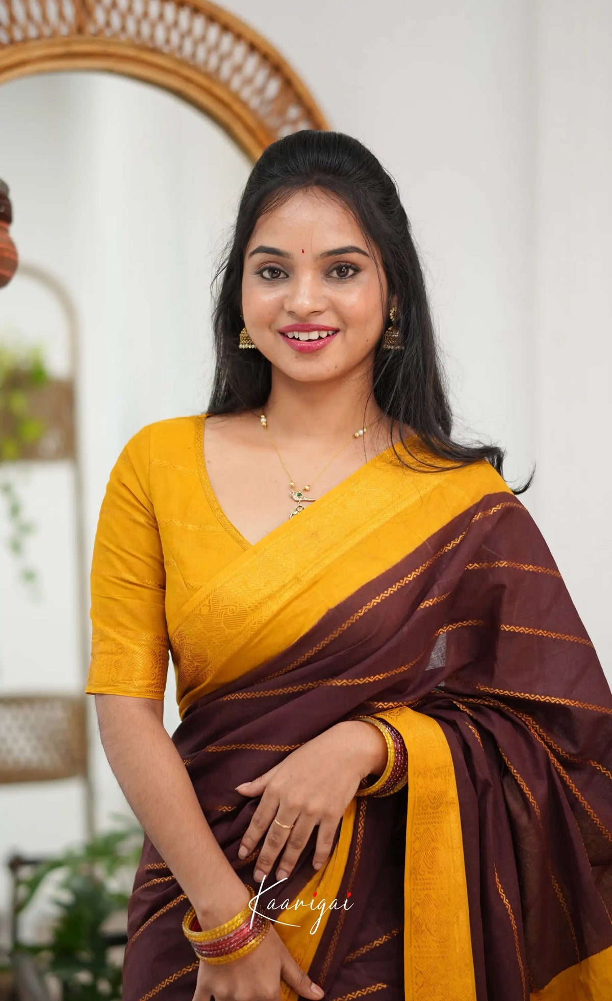 Saaral - Dark brown and Henna yellow Sungudi Saree - Sarees