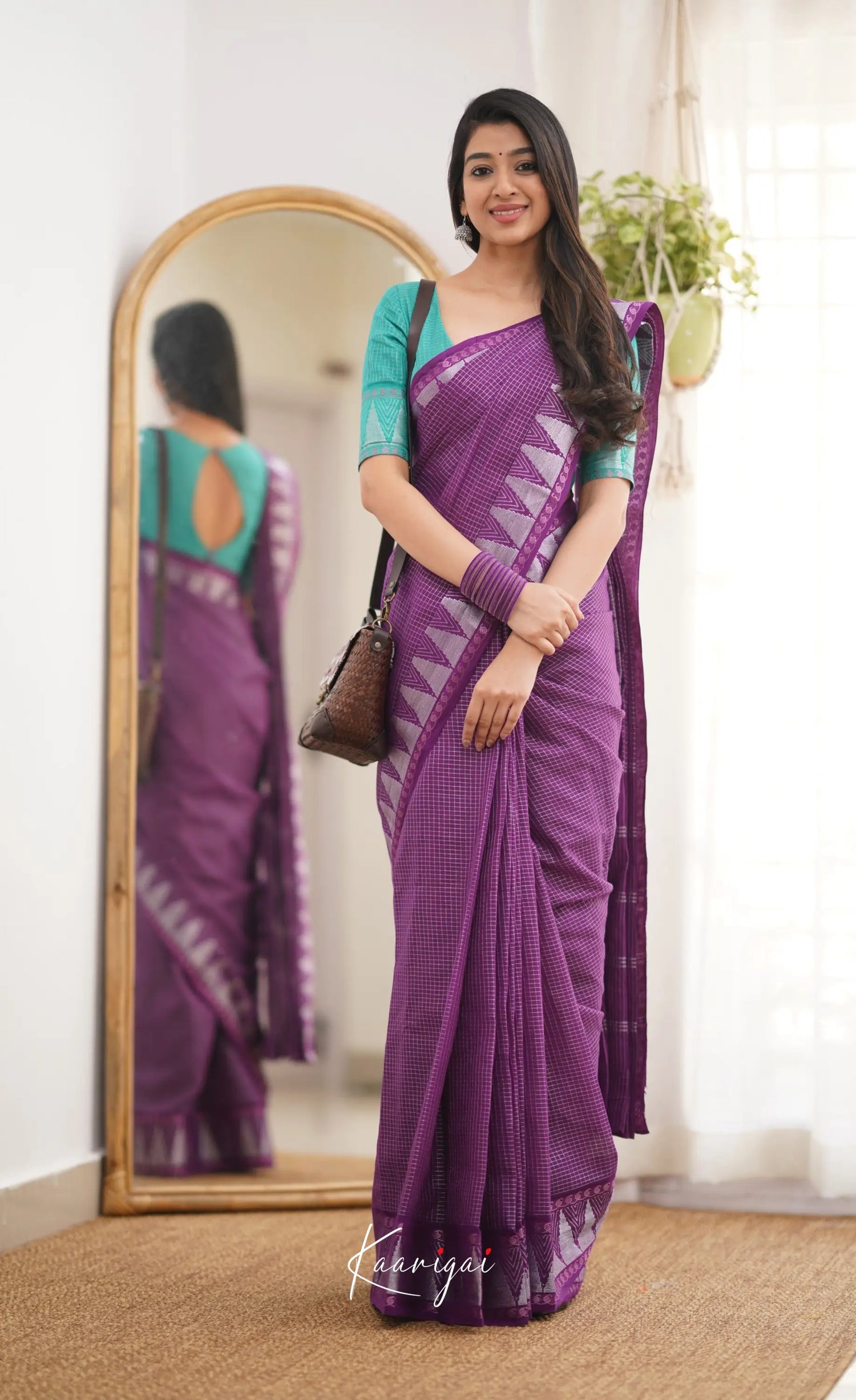 Saaral Dark Purple Shade And Teal Green Tone Sungudi Saree Sarees