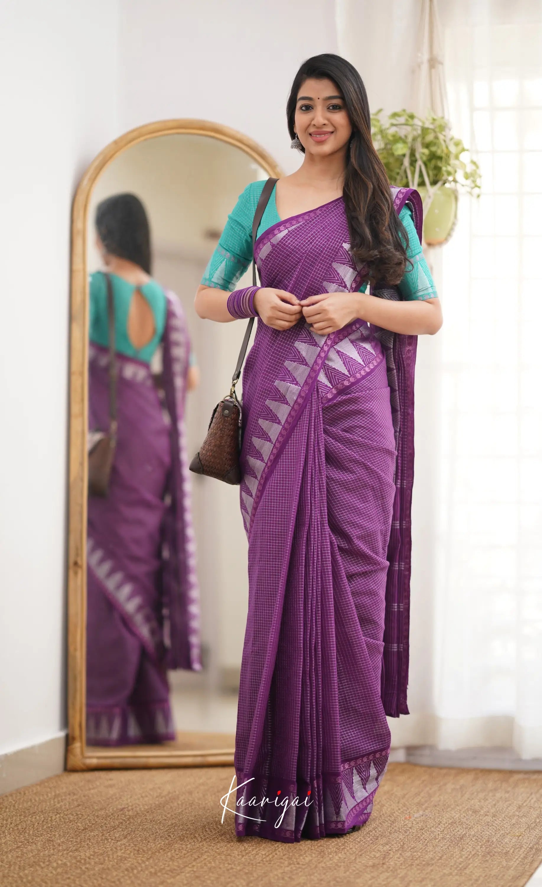 Saaral Dark Purple Shade And Teal Green Tone Sungudi Saree Sarees