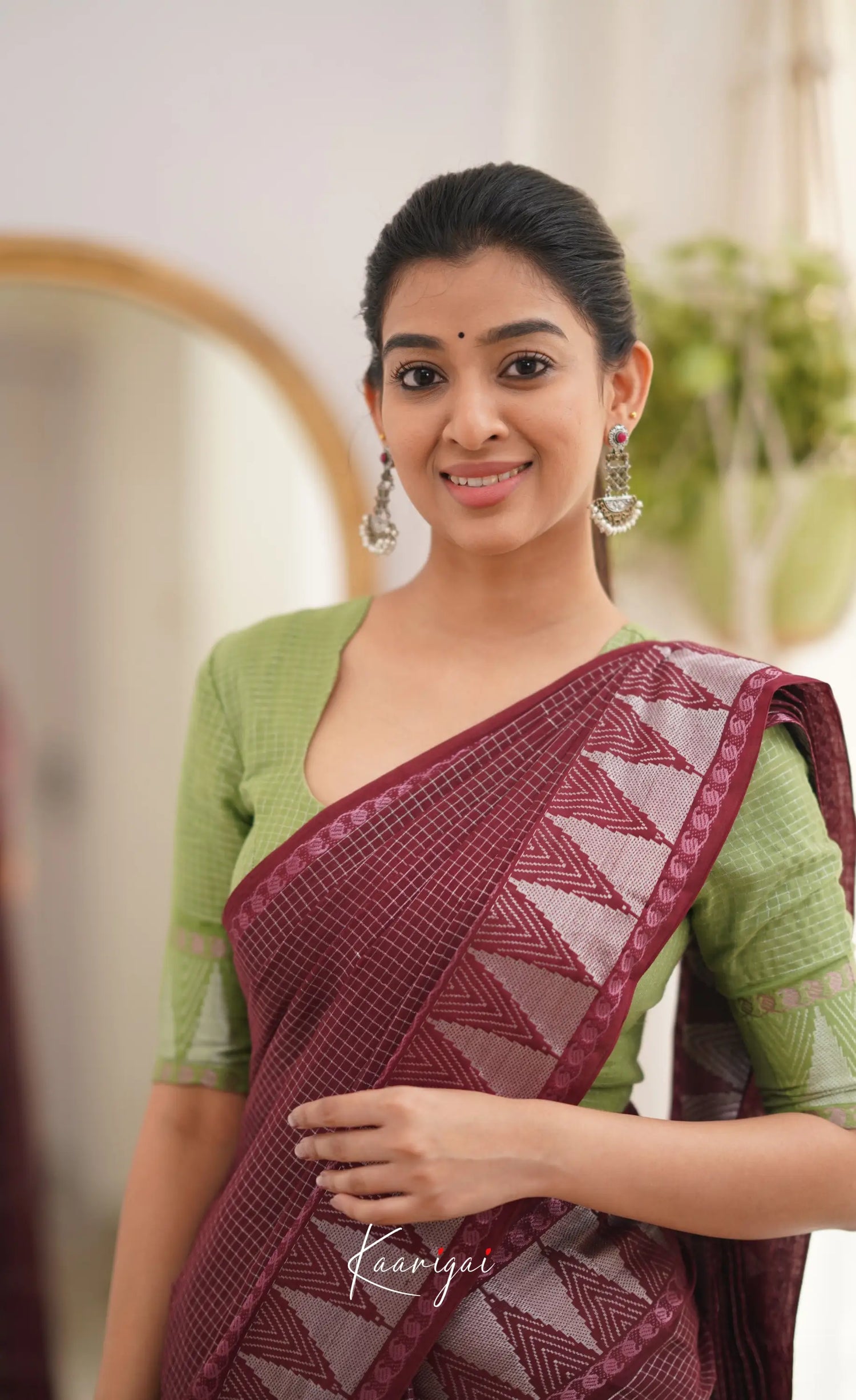 Saaral Maroonish Brown Shade And Pista Green Tone Sungudi Saree Sarees