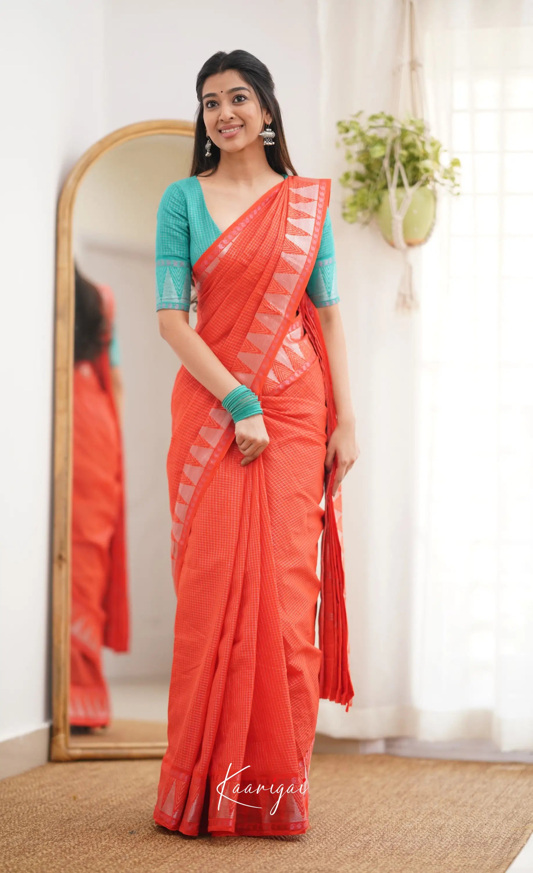 Saaral Orange Shade And Teal Green Tone Sungudi Saree Sarees