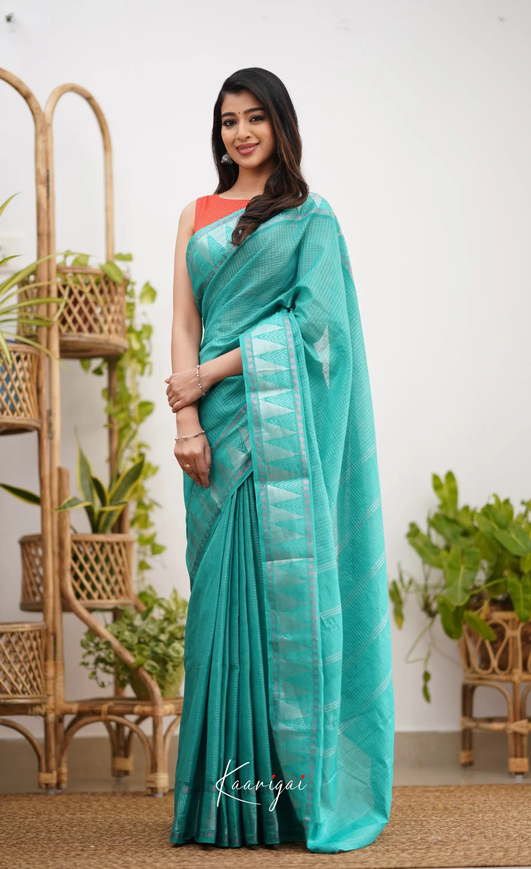 Saaral Teal Green Shade And Orange Tone Sungudi Saree Sarees