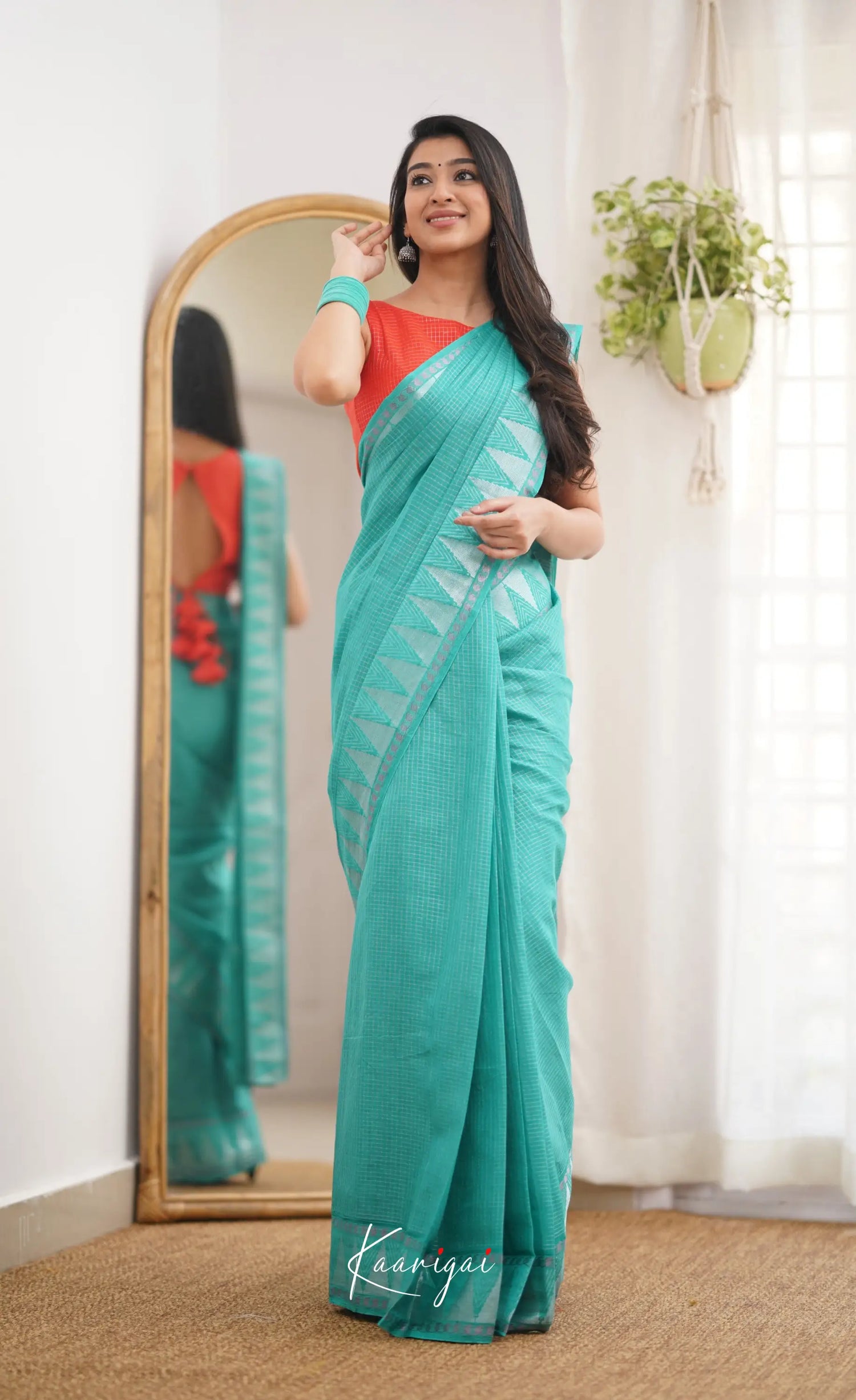 Saaral Teal Green Shade And Orange Tone Sungudi Saree Sarees