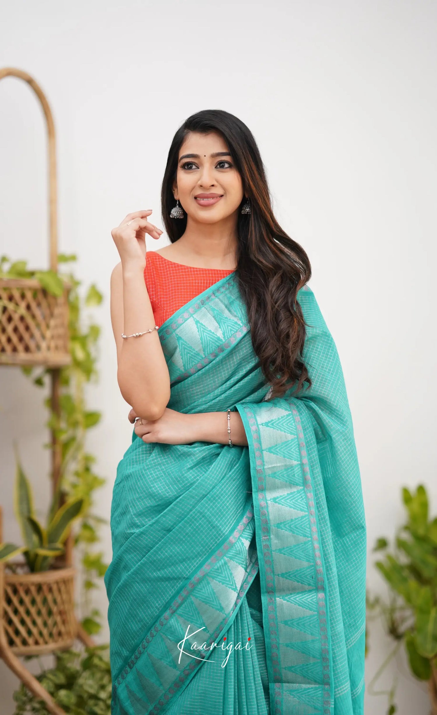 Saaral Teal Green Shade And Orange Tone Sungudi Saree Sarees