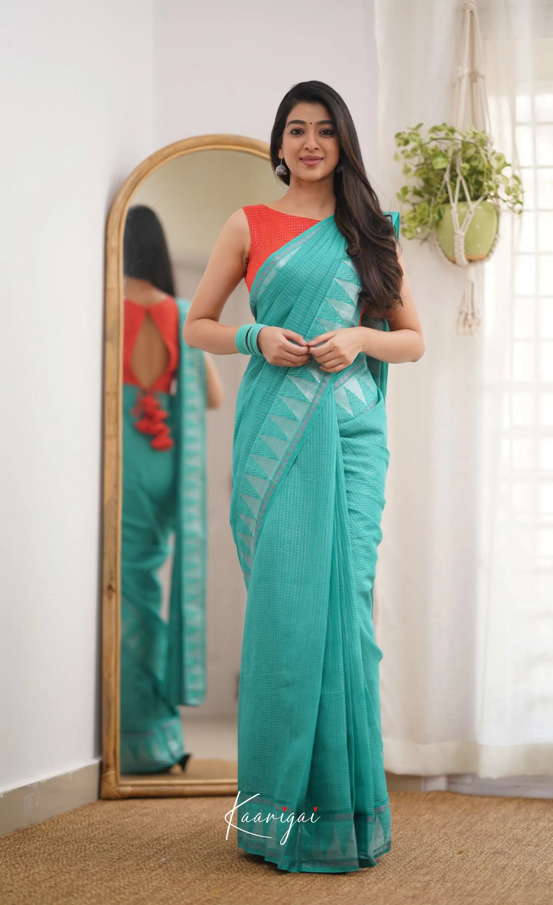 Saaral Teal Green Shade And Orange Tone Sungudi Saree Sarees